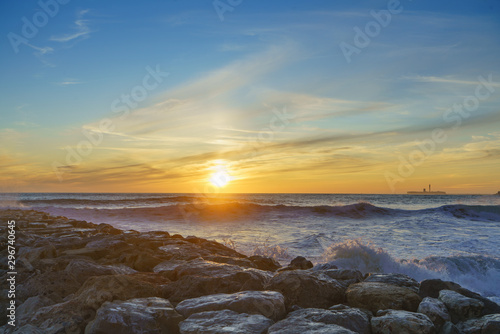 Sea wave splash on the sunset in Cadiz, Spain © elvirkin