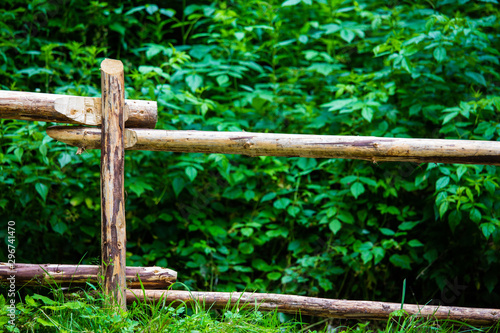 Old wooden fence on the mountain. In the background