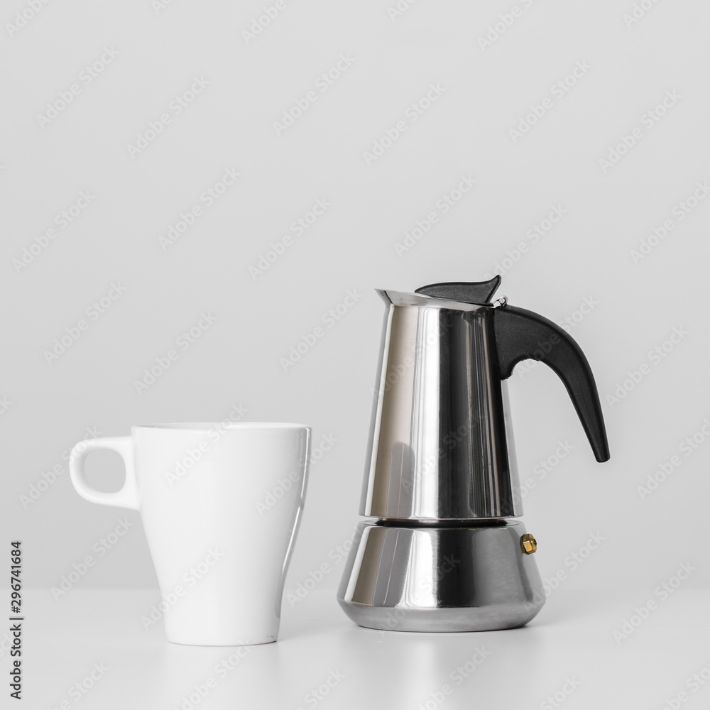 Close-up kettle and ceramic mug Close-up kettle and ceramic mug