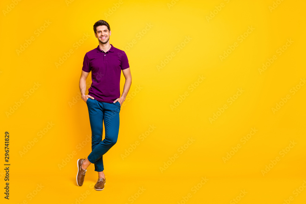 Full length body size view of his he nice attractive cheerful cheery glad content guy crossed legs isolated over bright vivid shine vibrant yellow color background Full length body size view of his he nice attractive cheerful cheery glad content guy crossed legs isolated over bright vivid shine vibrant yellow color background
