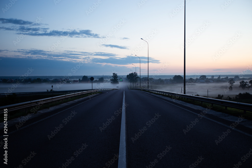 Noised Summer country road with fog. Rural up hill, vintage , environment Nature Asphalt road.