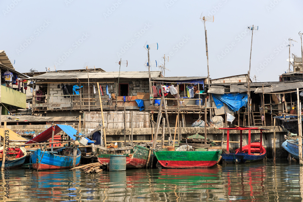 Beautiful view of generic homes at the waterfront in the old Sunda Kelapa harbor area in Jakarta, Indonesia