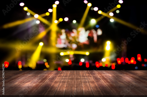 top desk with light bokeh in concert blur background,wooden table photo