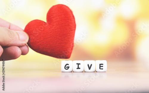 Give love with red heart in hand for donate and philanthropy health care love organ donation family insurance world heart day world health day - Concepts of sharing giving or valentines day photo