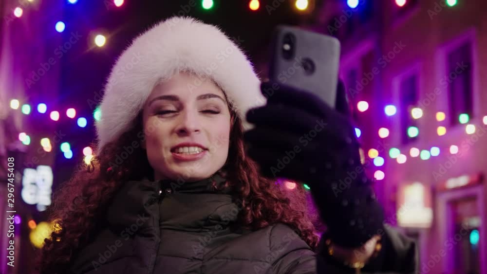 Woman making video call on a cold winter evening Woman making video call on a cold winter evening
