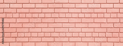 Coral painted brickwork wide background. Brick block widescreen texture. Peach color wall panorama