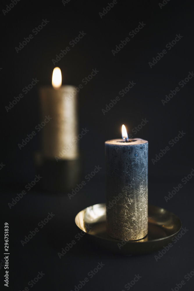Big burning candles in candlesticks Big burning candles in candlesticks
