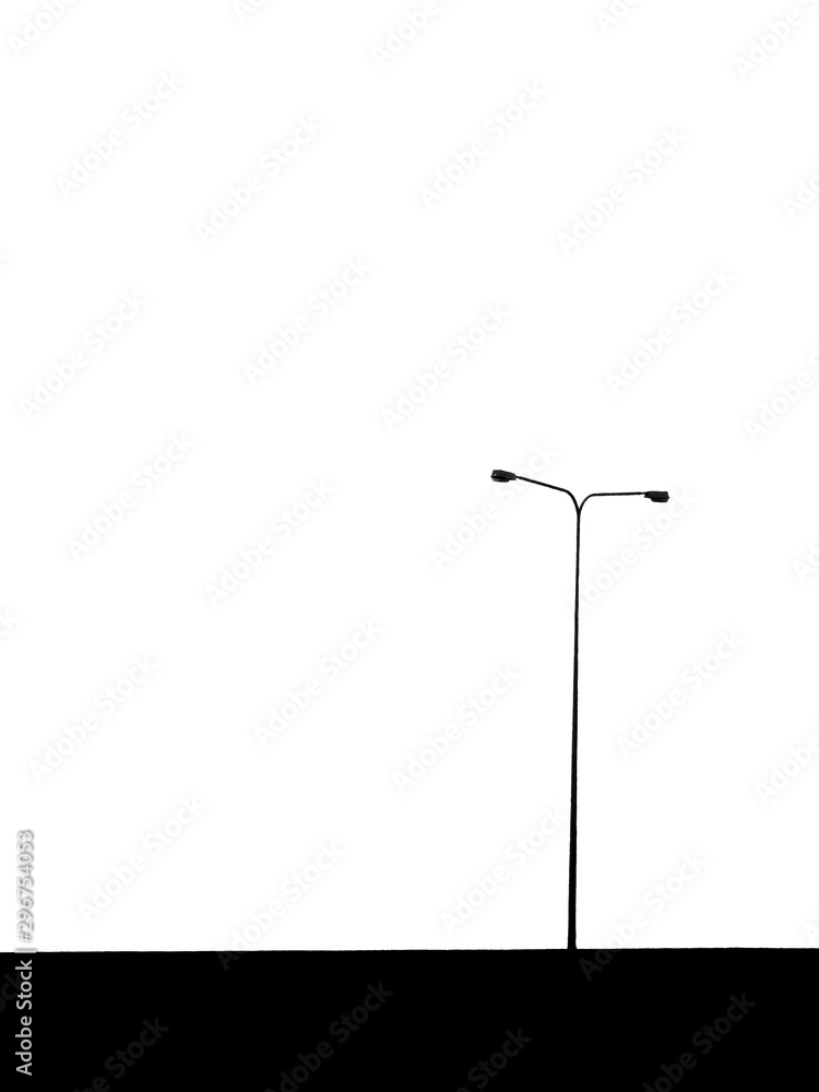 silhouette of street lamp post on expressway silhouette of street lamp post on expressway