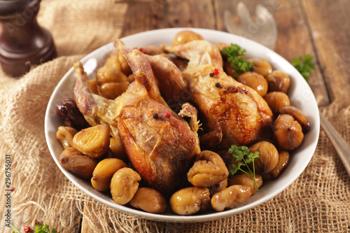 Fototapeta Naklejka Na Ścianę i Meble -  baked quail with chestnut- autumn dish on wood background