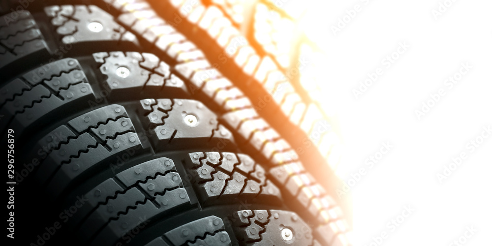 winter tire on a white background, flare effect, copy space winter tire on a white background, flare effect, copy space