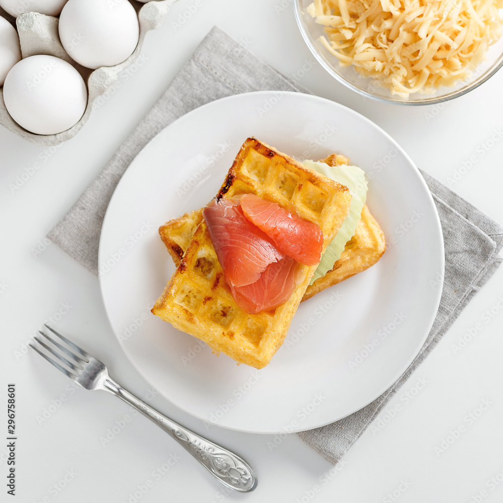 Chaffles with salmon. Egg and cheese waffles for breakfast. Keto diet. Cheese waffle. Chaffles with salmon. Egg and cheese waffles for breakfast. Keto diet. Cheese waffle.