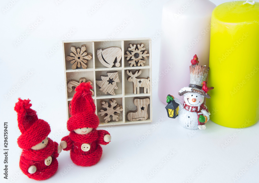 The candles are different, the snowman doll and a set of Christmas wooden toys