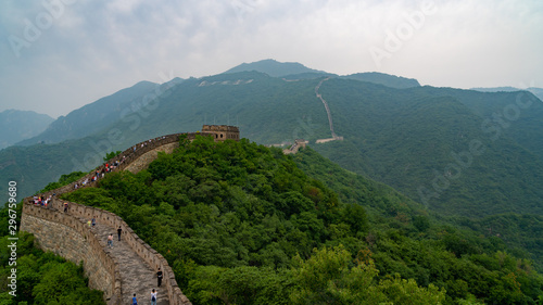 Great Wall of China with a green trees in a background.