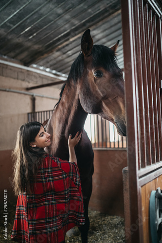 Girl embraces her pet horse © Suteren Studio