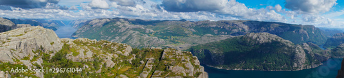 Panoramic view from the top of Preikestolen fjords. Lake below and between fjords in valley