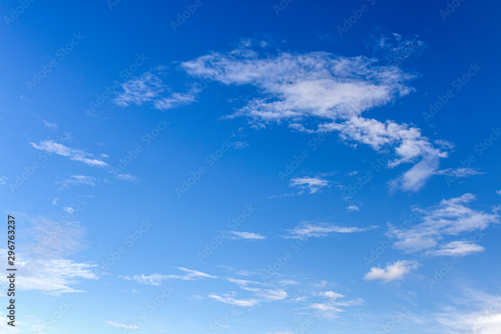 Fluffy white clouds flying on blue sky background Fluffy white clouds flying on blue sky background