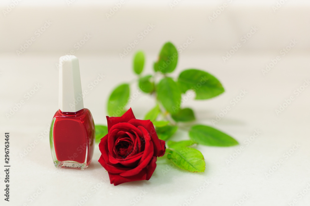 red nail polish and red rose in white marble red nail polish and red rose in white marble