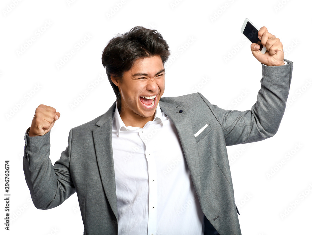 Portrait of happy Asian businessman with phone on white background Portrait of happy Asian businessman with phone on white background