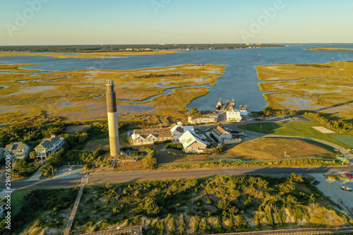 Oak Island North Carolina lighthouse view from the air. The inter coastal waterway is in the background.