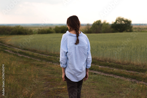 Happy Young Woman  in a linen shirt In A Field 