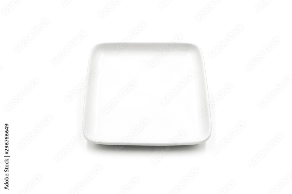 One square white ceramic plate isolated on white background One square white ceramic plate isolated on white background