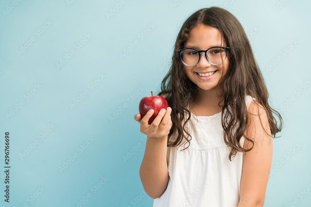 Cute Girl With Healthy Fruit Standing Against Plain Background Cute Girl With Healthy Fruit Standing Against Plain Background