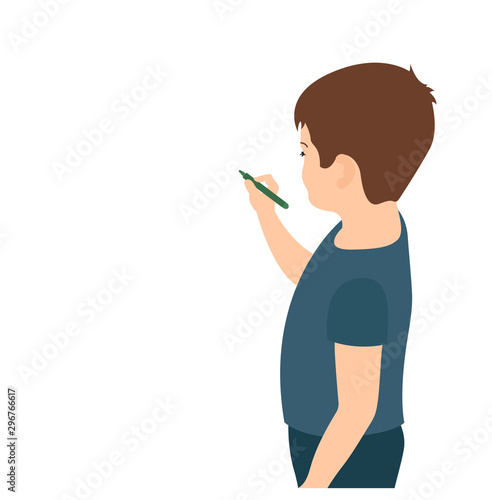 boy with a felt-tip pen in his hand stands writes on the wall, empty space