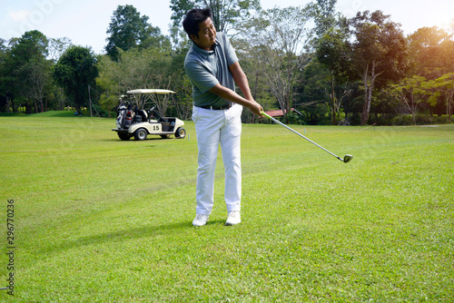 Golfer playing golf in beautiful golf course in the evening golf course