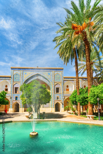 View of fountain in the middle of traditional Persian courtyard