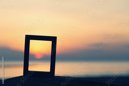 Picture frames placed on sandy beaches during the time Sunset concept idea background nature style abstract