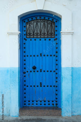 Blue painted wooden door with black decoration © Picture Partners