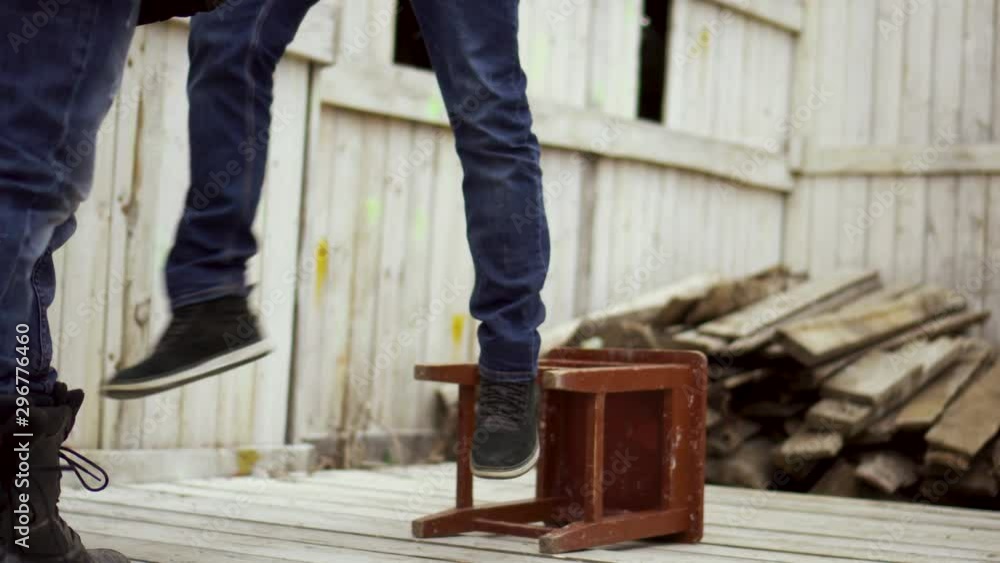 Video Stock Man trying stay chair on gallow closeup when executioner
