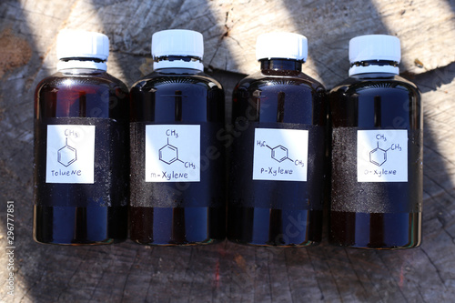 Dark plastic bottles with aromatic hydrocarbons: toluene, m-xylene, p-xylene, o-xylene. Substances are used in the paint and varnish industry, for the production of drugs, antibiotics. photo