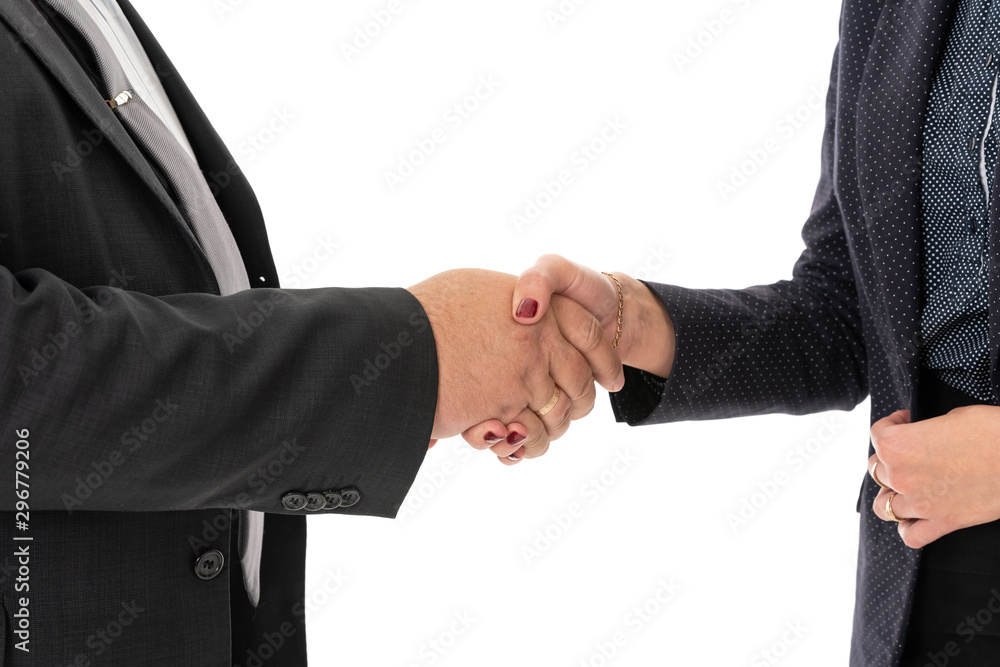 Hand shake between a businessman and a businesswoman isolated on white Hand shake between a businessman and a businesswoman isolated on white