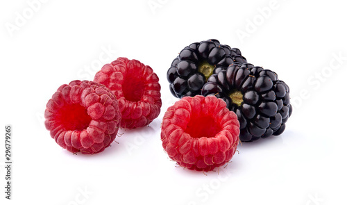 Fresh ripe berries in closeup on white background. Raspberry with blackberry isolated.