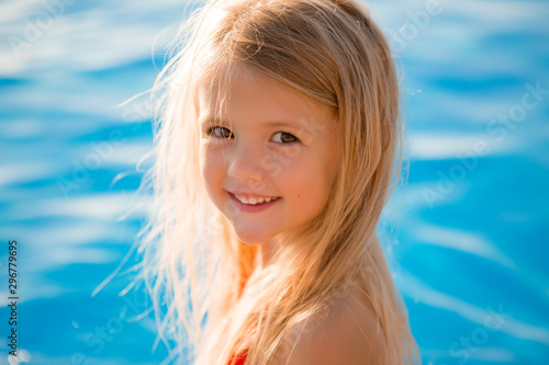 little blonde girl in swimming pool in summer © КРИСТИНА Игумнова