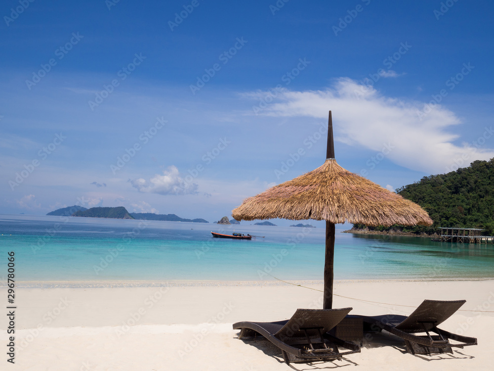 Seats with sun shelter on white sand beach sea view background, .Travel plans after retirement of business people