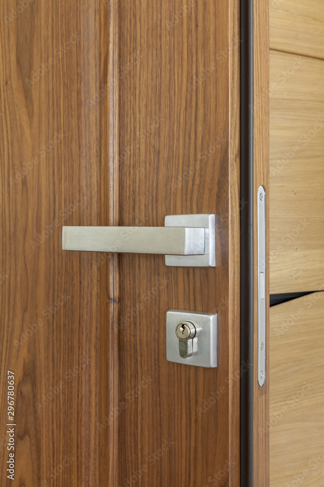 metal door handle and lock on wooden door metal door handle and lock on wooden door