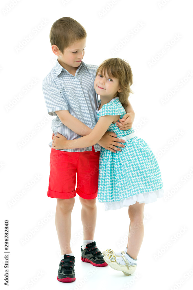 Boy and girl brother and sister gently hug Boy and girl brother and sister gently hug