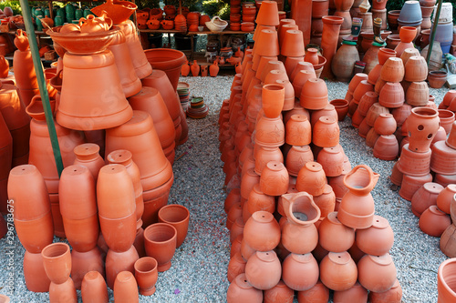Handmade ceramic crockery made of clay of brown terracotta color