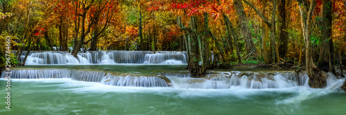 Fototapeta Naklejka Na Ścianę i Meble -  Colorful majestic waterfall in national park forest during autumn, panorama - Image
