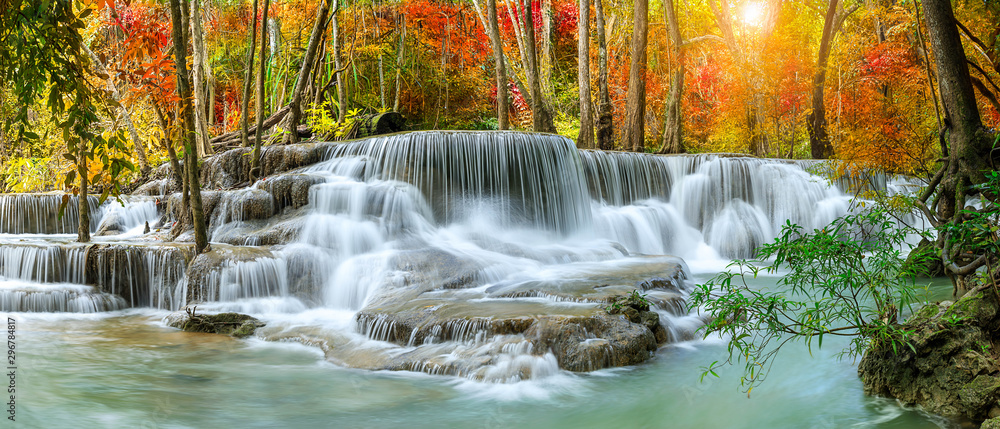 Colorful majestic waterfall in national park forest during autumn, panorama - Image - obrazy, fototapety, plakaty 