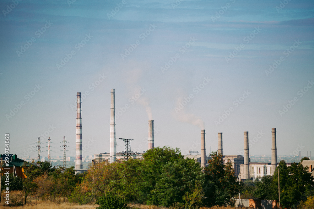 chemical factory throwing out polluting smoke from pipes. metallurgical plant