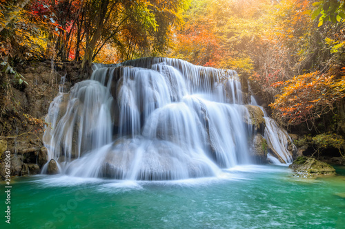 Fototapeta Naklejka Na Ścianę i Meble -  Beautiful and colorful waterfall in deep forest during idyllic autumn