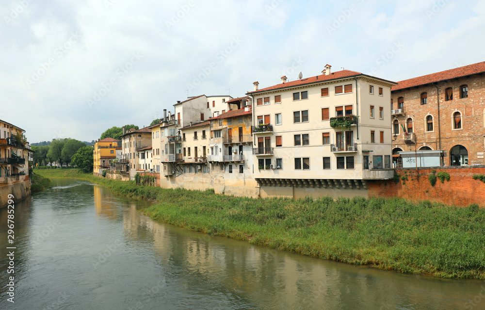 Wide Bacchiglione River and the houses in Vicenza City in italy