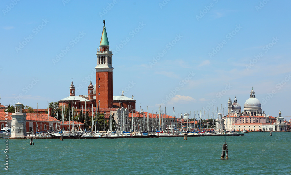 Fototapeta premium Saint George Church with many boats moored on the harbor on the