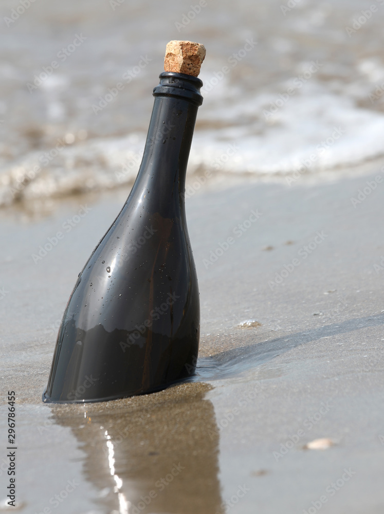 message in a bottle with tap in cork message in a bottle with tap in cork