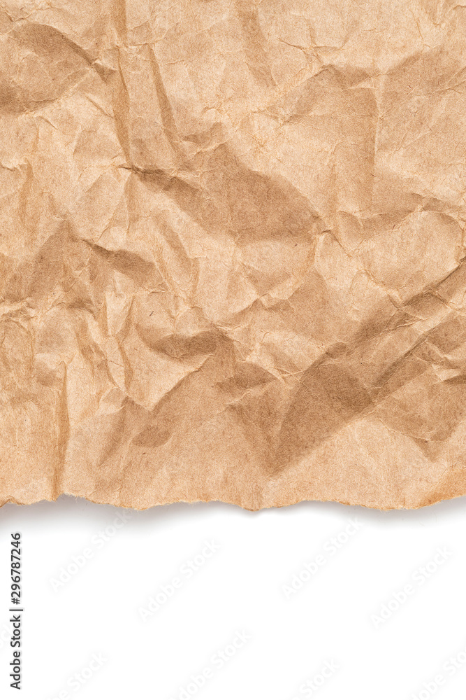 Fototapeta premium Brown crumpled wrapping paper with torn border