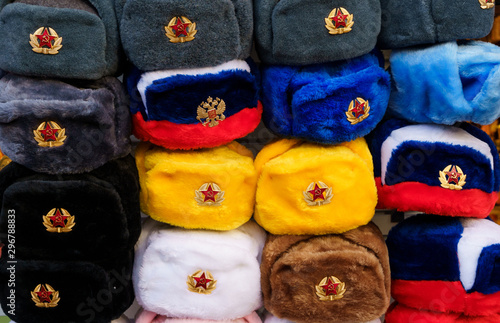 Traditional russian ushanka hats in many colors with symbols of Russia and Soviet Union in Moscow, Russia © Elena Sistaliuk