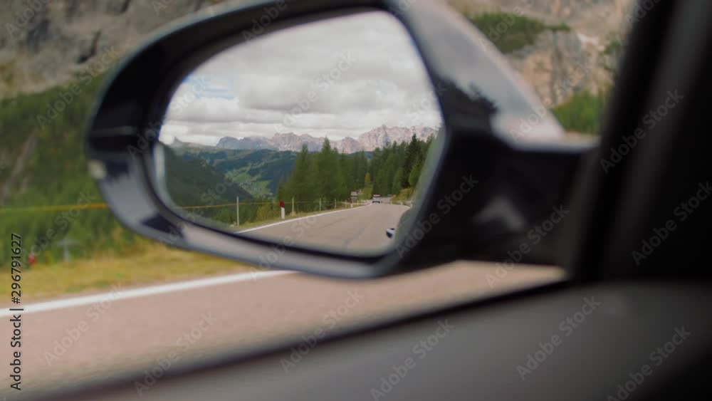 Car mirror driving shot of the Calfosch mountains. Incredible, exploration, adventure. (Calfosco)
Car mirror driving shot of the Calfosch mountains. Incredible, exploration, adventure. (Calfosco)